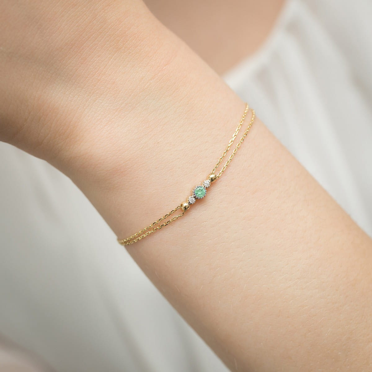 Изображение Браслет из желтого золота с бриллиантами и изумрудом